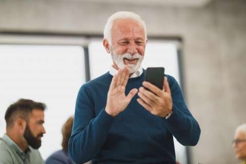 1763702638-elderly-man-video-chatting-on-smartphone