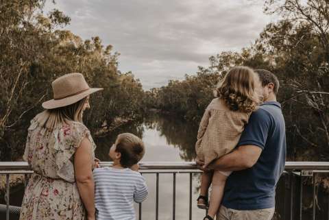 family looking at river photo for Visitor Centre wall low res