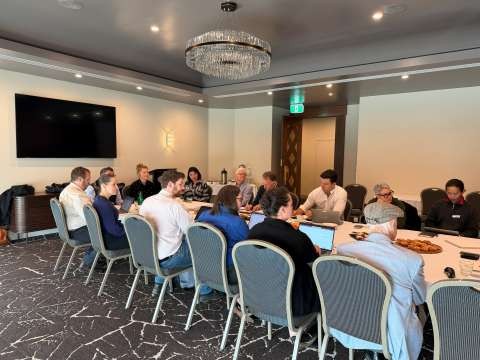 An engagement group sitting around a large table